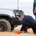 Traction boards being used for 4x4 sand recovery