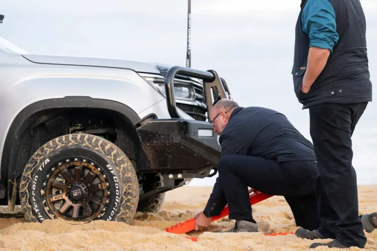 Traction boards being used for 4x4 sand recovery