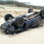 Picture of 4x4 vehicle smashed on a beach