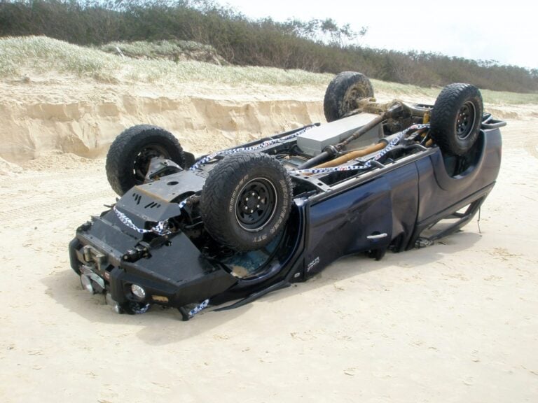 Picture of 4x4 vehicle smashed on a beach