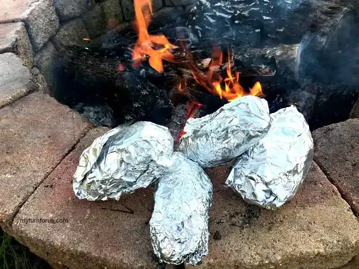 Potato boats made in a campfire