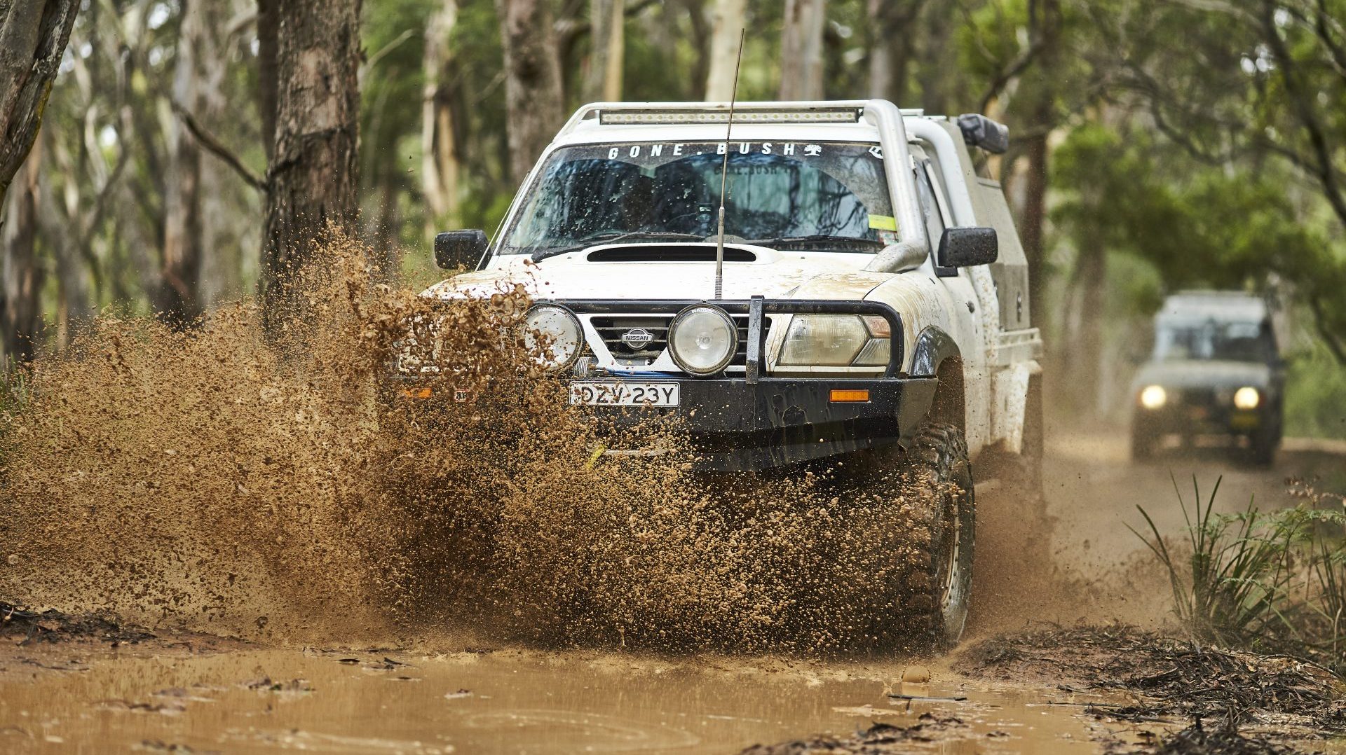 A GU Patrol driving through mud