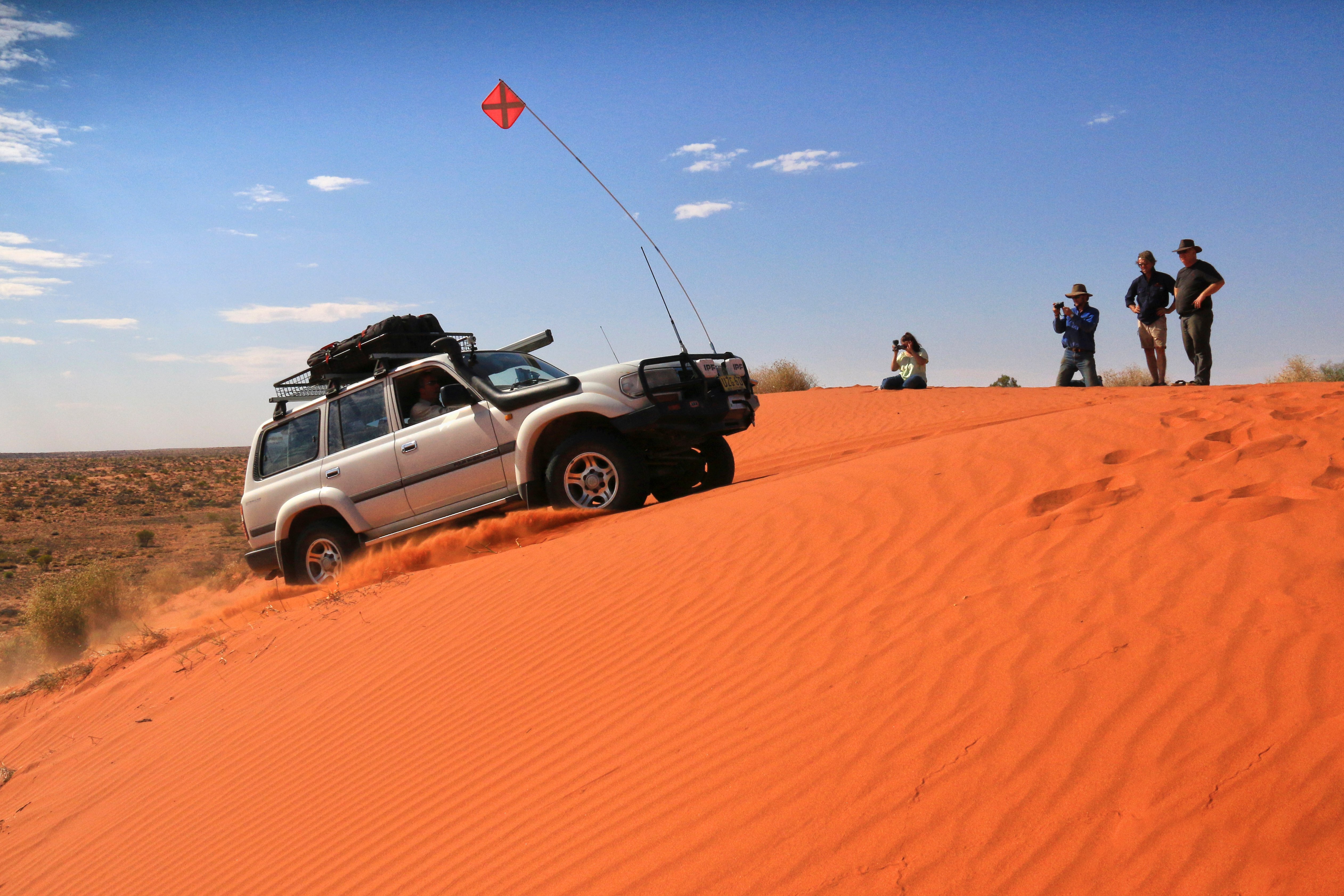 Car with sand flag
