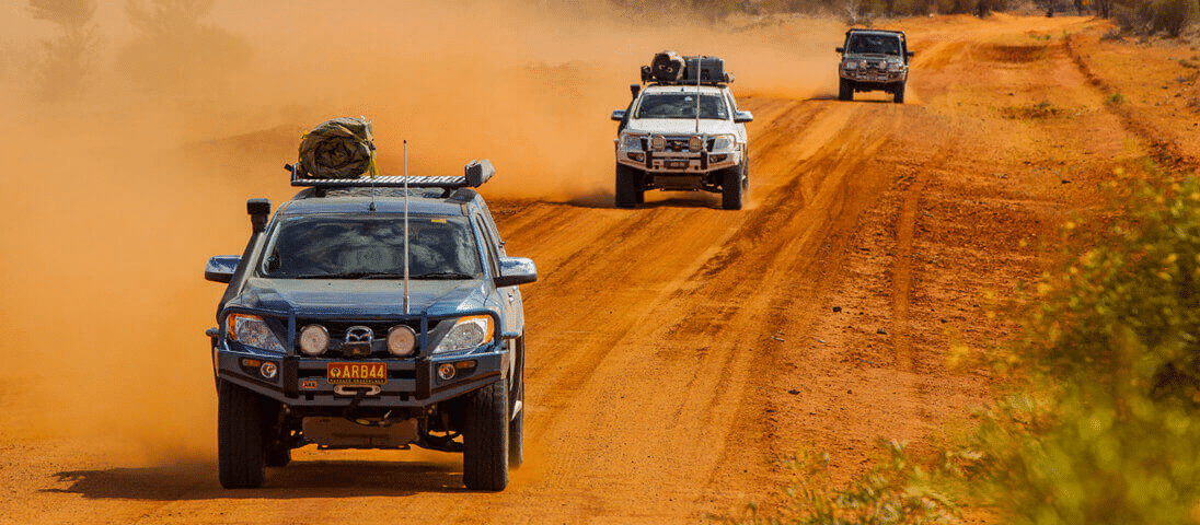Vehicle with snorkel on dirt road