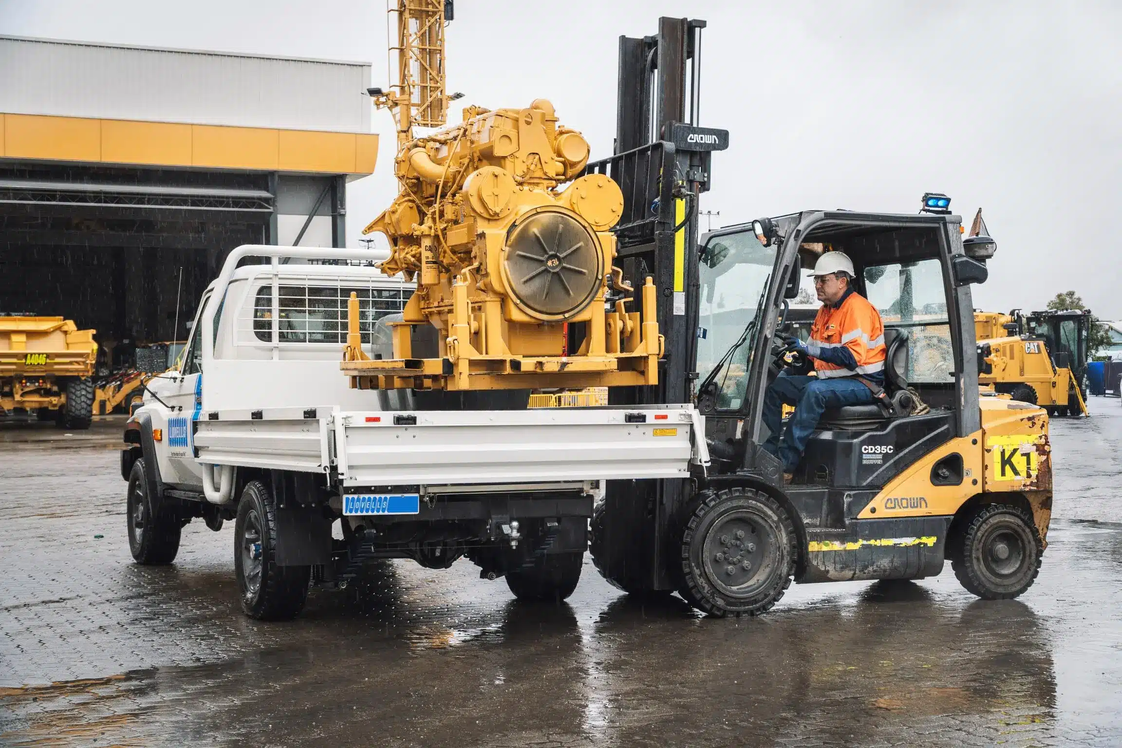 Lovells-upgraded 79 Series being loaded with heavy machinery by forklift during field testing