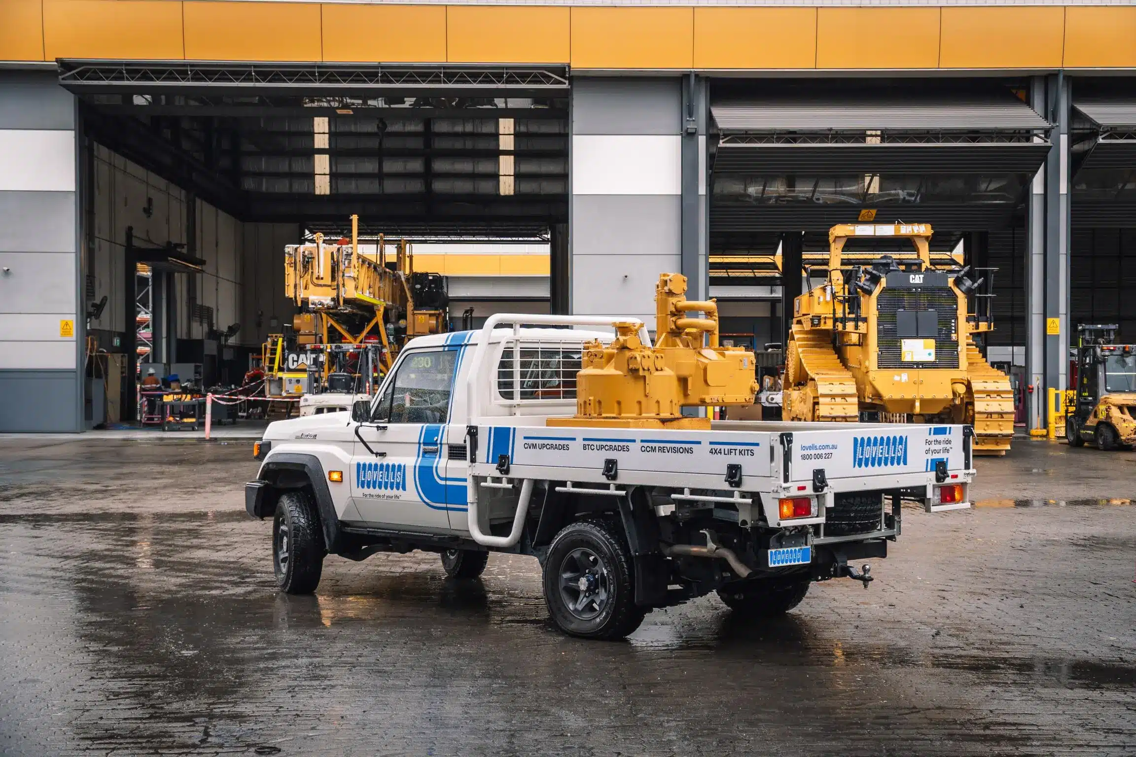 Toyota 79 Series with Lovells Elite Series GVM upgrade carrying heavy industrial equipment on tray