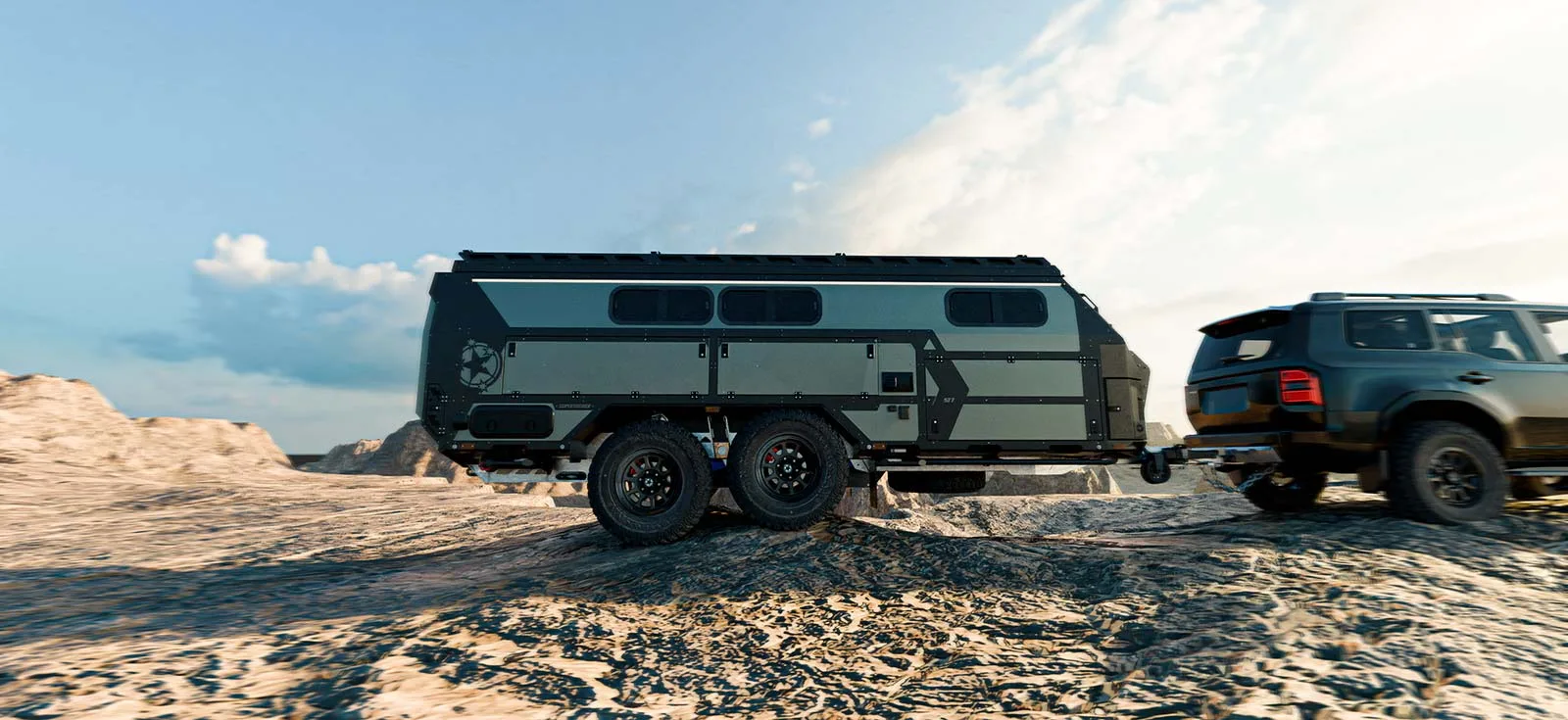 Large camper trailer being towed through rough outback terrain
