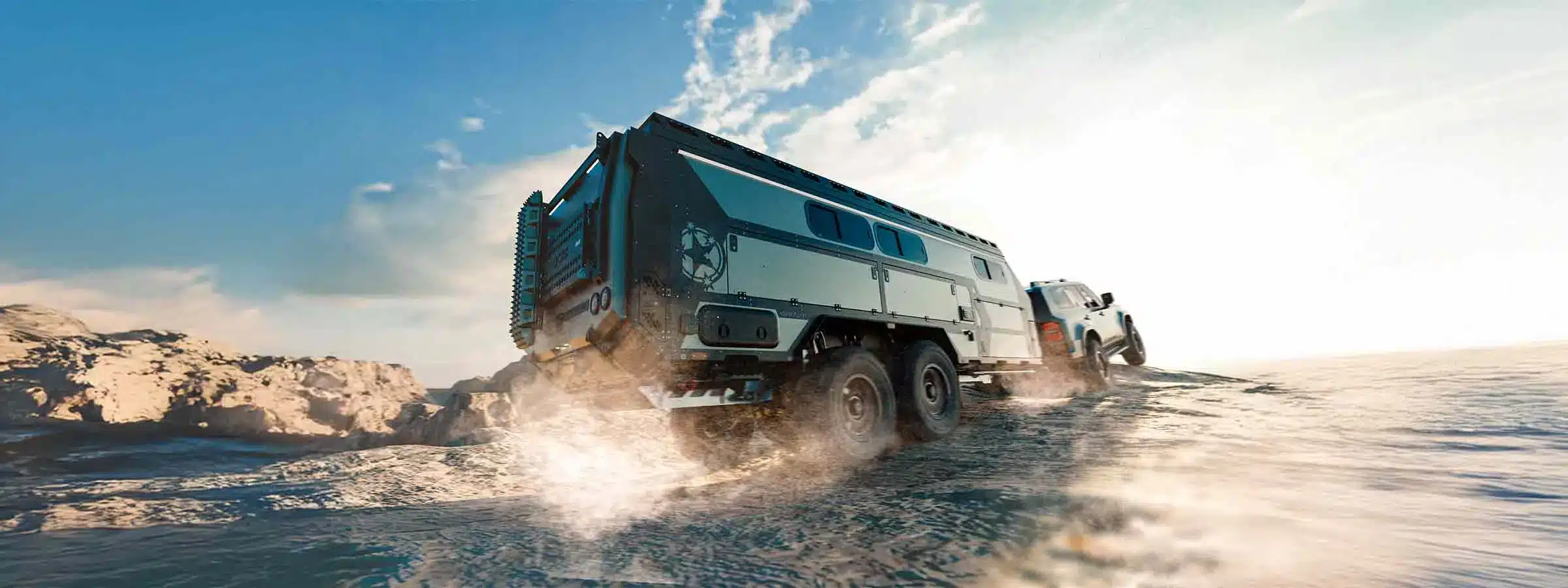 Patriot Campers ST7 Supertourer being towed off-road