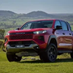 The 2026 Toyota HiLux features Australian-designed Cyber Sumo styling with high-set LED headlights and body-coloured mesh grille.