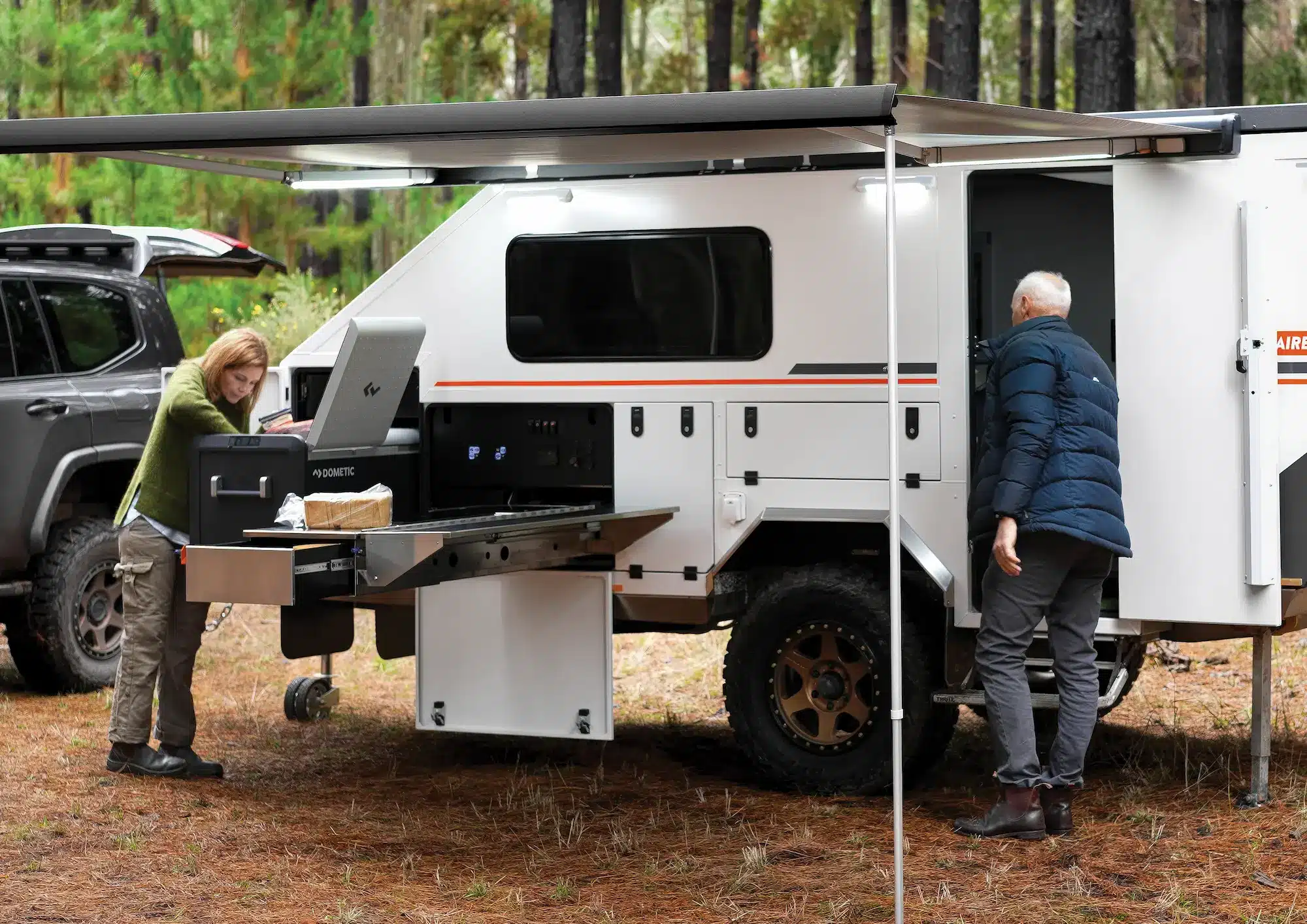 Solitaire hybrid camper external kitchen with slide-out bench and plumbed hot water