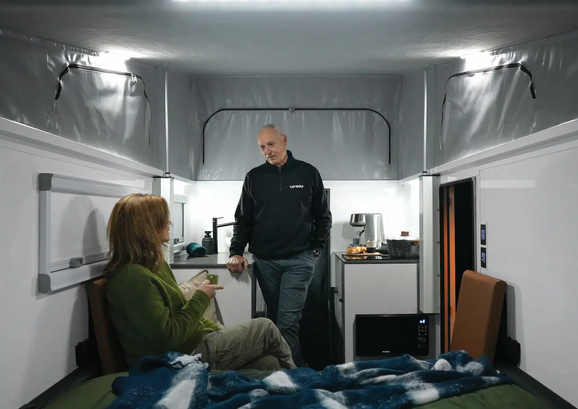 Offline Campers Good Design Award winner interior with cafe lounge and queen bed