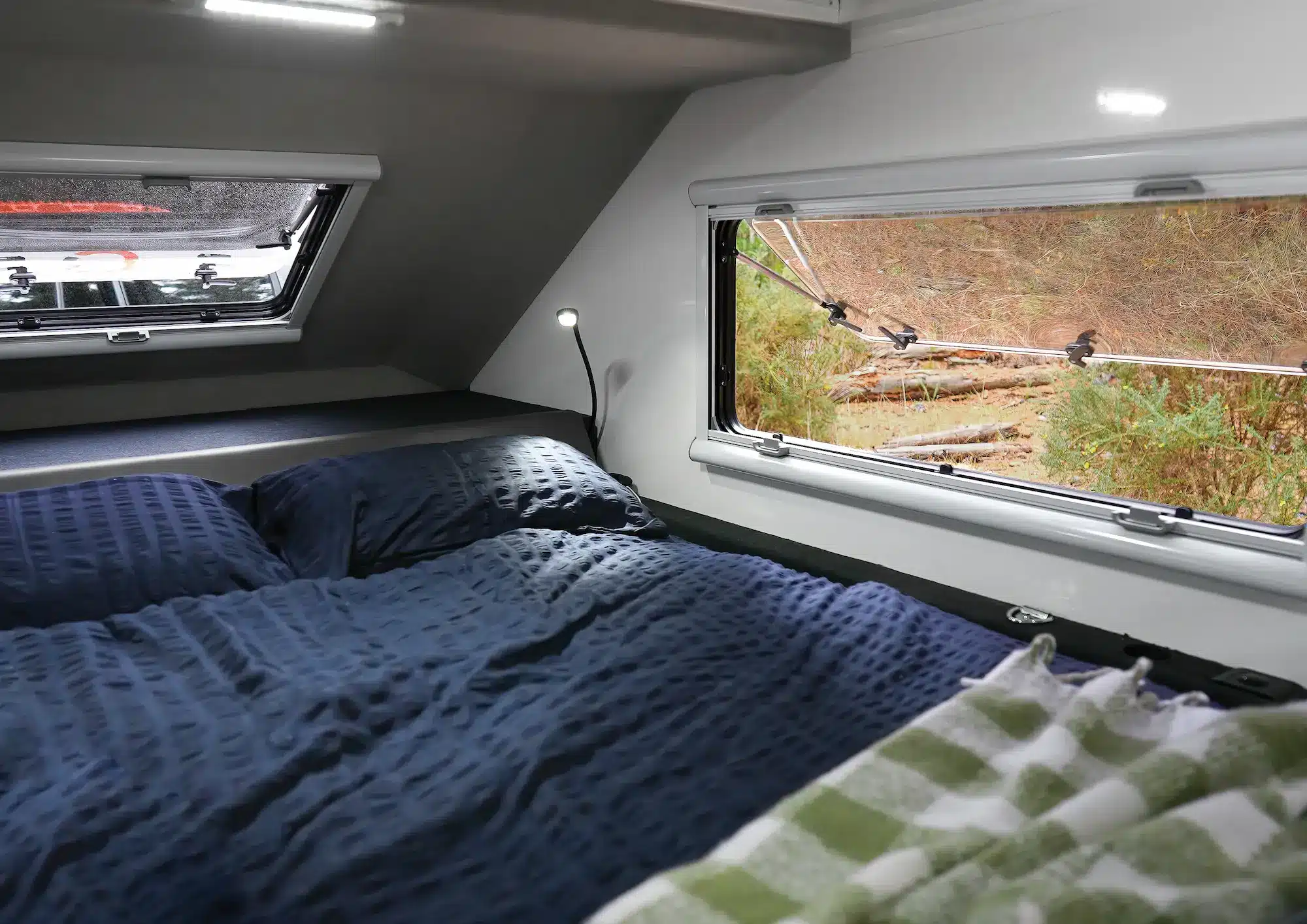 Queen-sized innerspring mattress in Offline Campers Solitaire award-winning camper