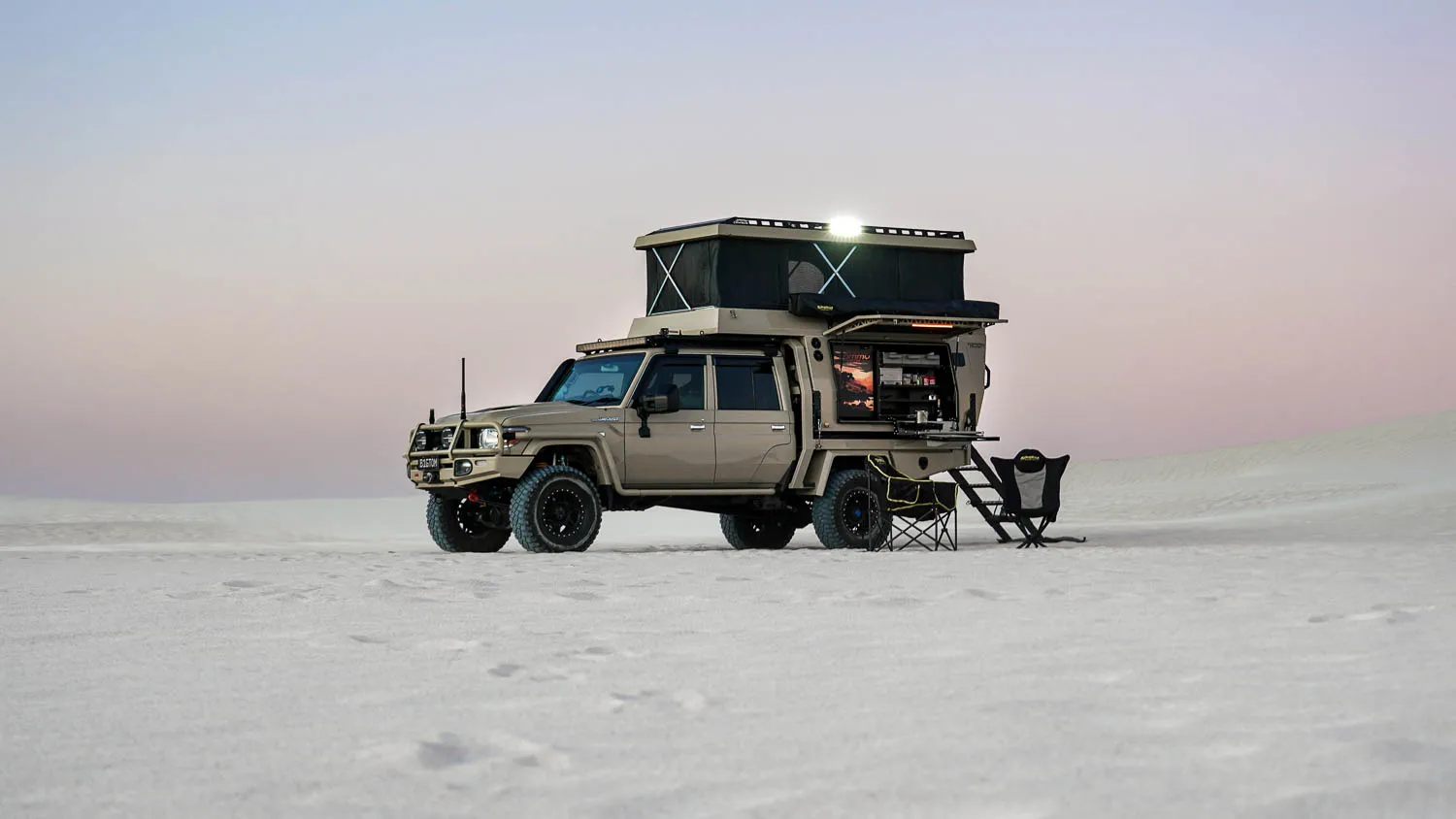 Front three-quarter view showing the lifted stance and ARB bar work