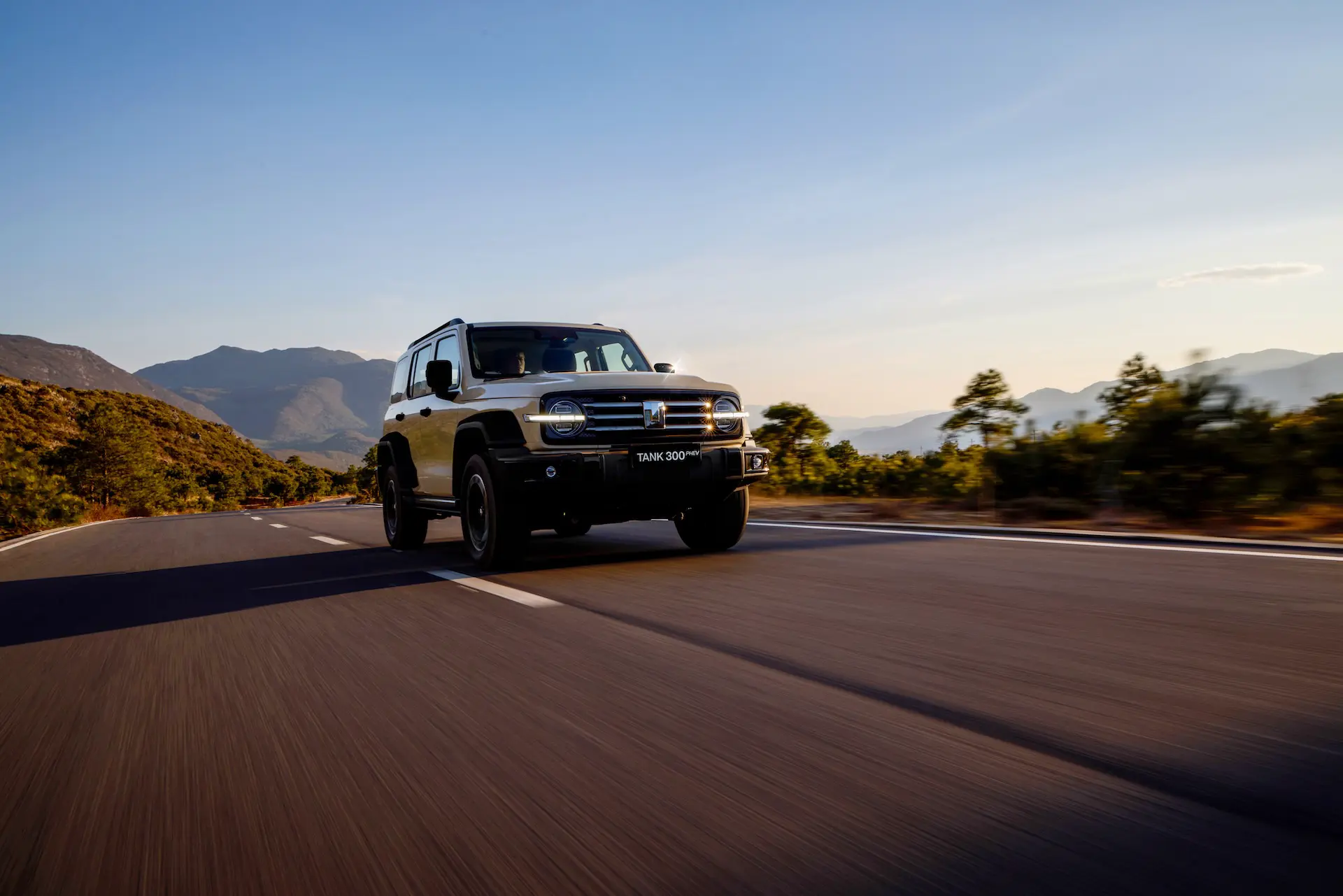 Front three-quarter shot of the new plug-in hybrid SUV driving on an Australian road