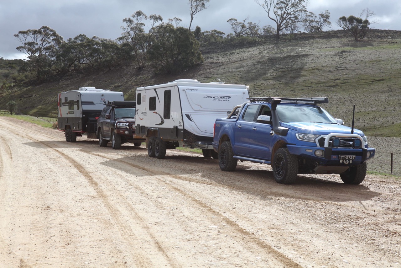 Off-road caravans and camper trailers set up outdoors at the show